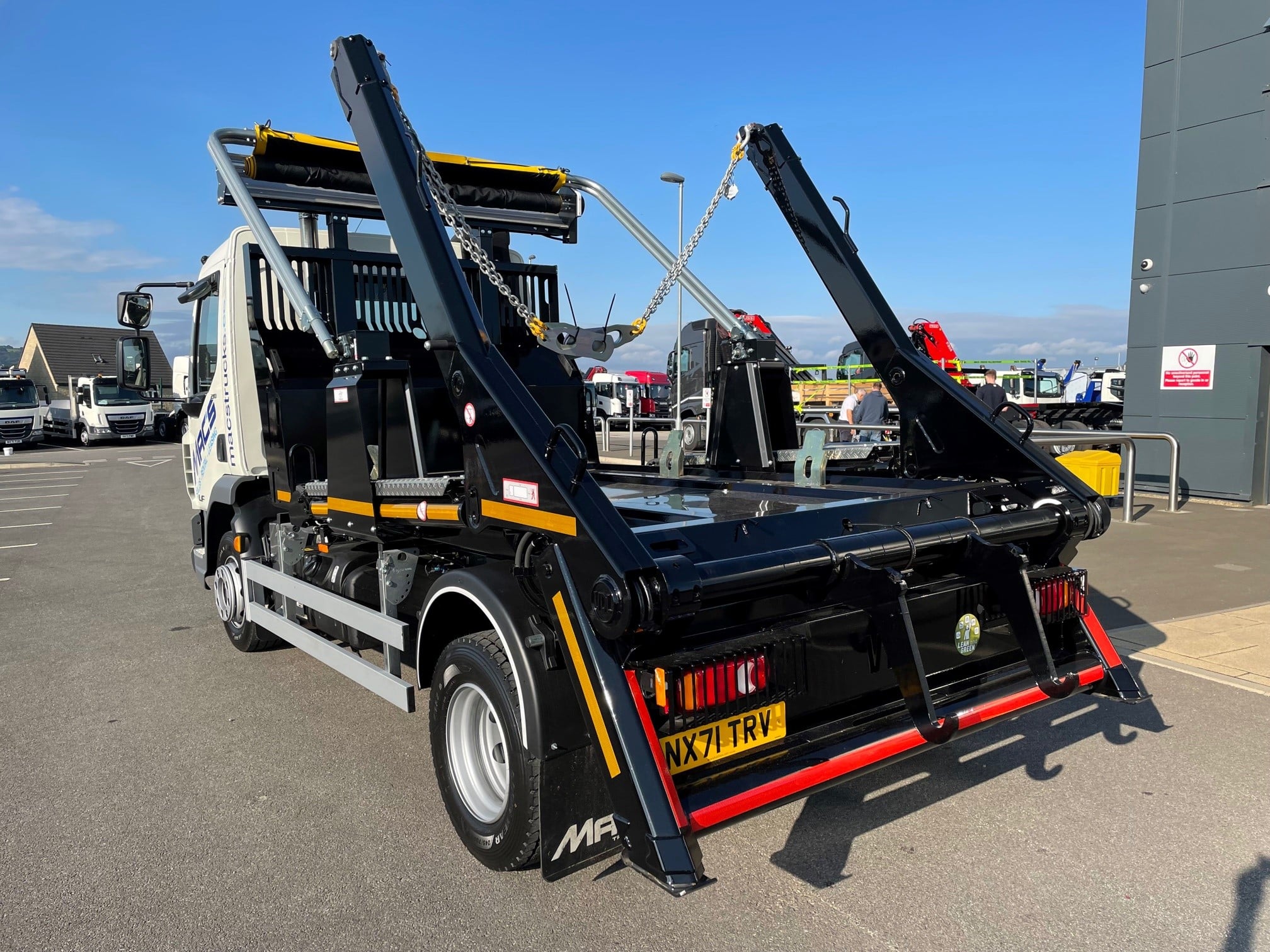 A 12 Tonne skiploader truck available to rent an hire